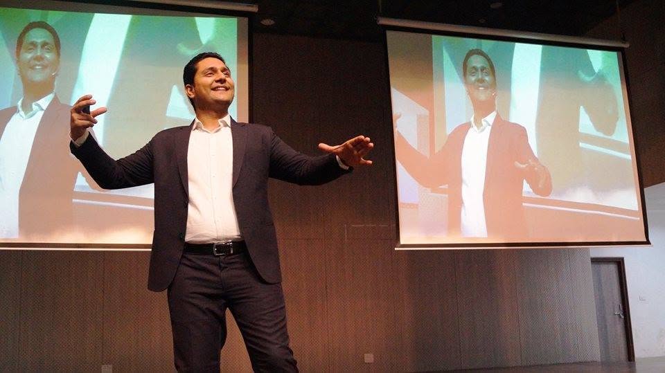 Parikshit Jobanputra parenting coach addressing an audience on stage Parikshit Jobanputra parenting coach addressing an audience on stage