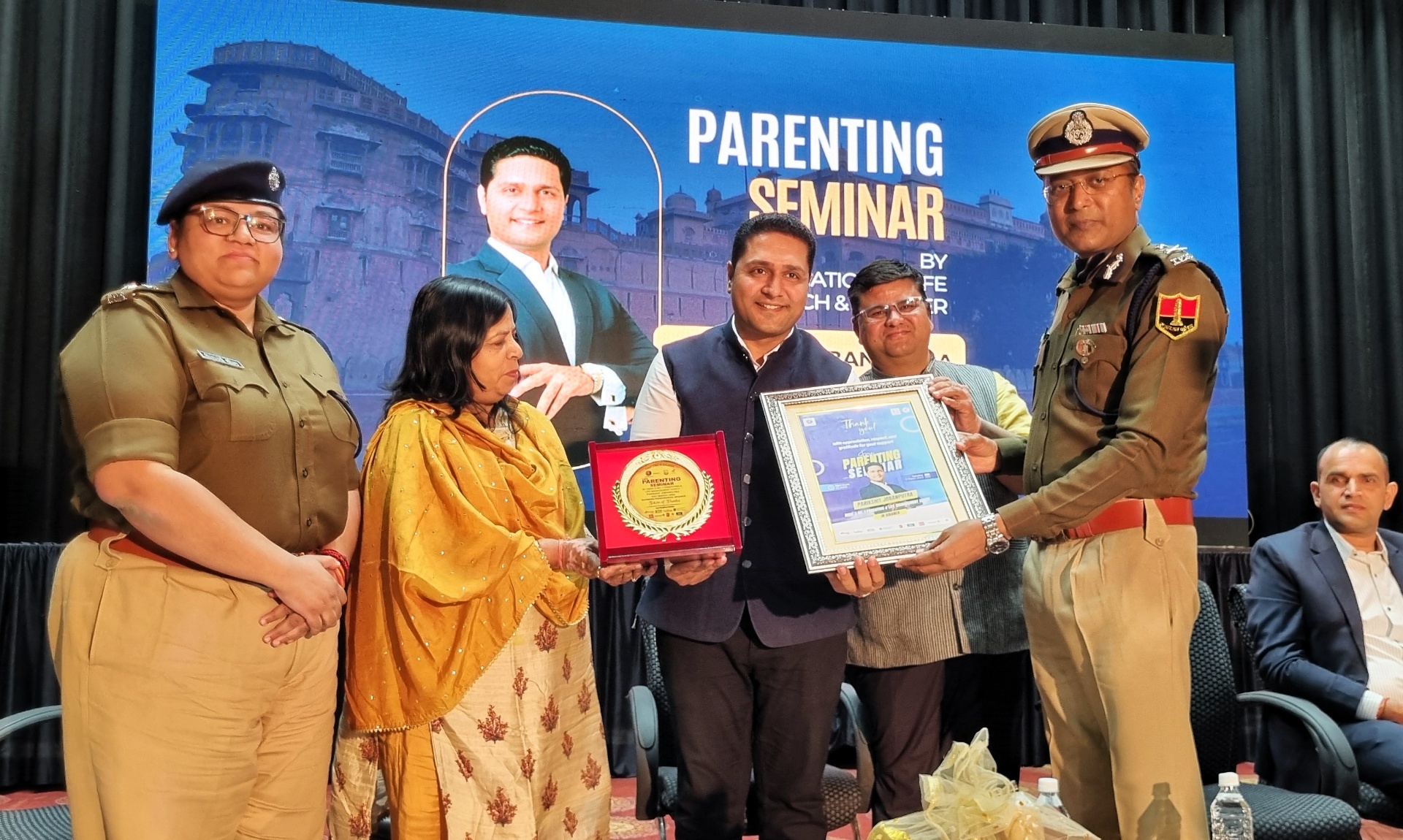 Parikshit Jobanputra receiving an honour from police officers at a parenting seminar Parikshit Jobanputra receiving an honour from police officers at a parenting seminar